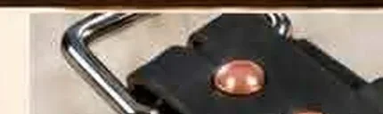 Copper rivets used to secure a leather belt buckle